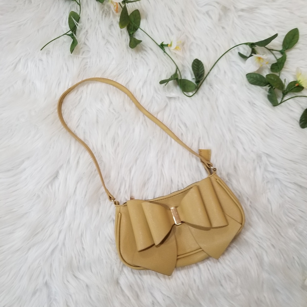 Crossi Mini Shoulder Bag with Mustard Yellow Bow, Gold Hardware and Zipper.
